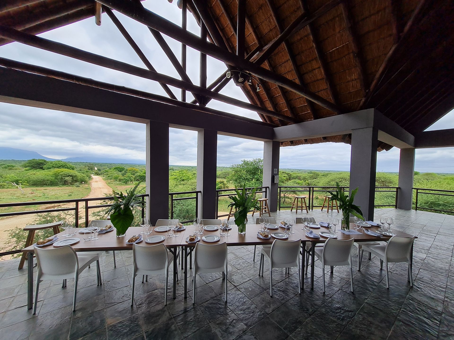 a large room with tables and chairs and a view